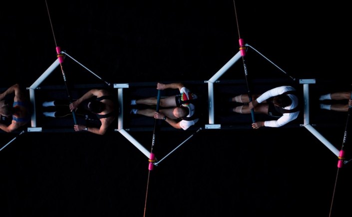 Rowers on a boat. Image by Josh Calabrese on Unsplash.